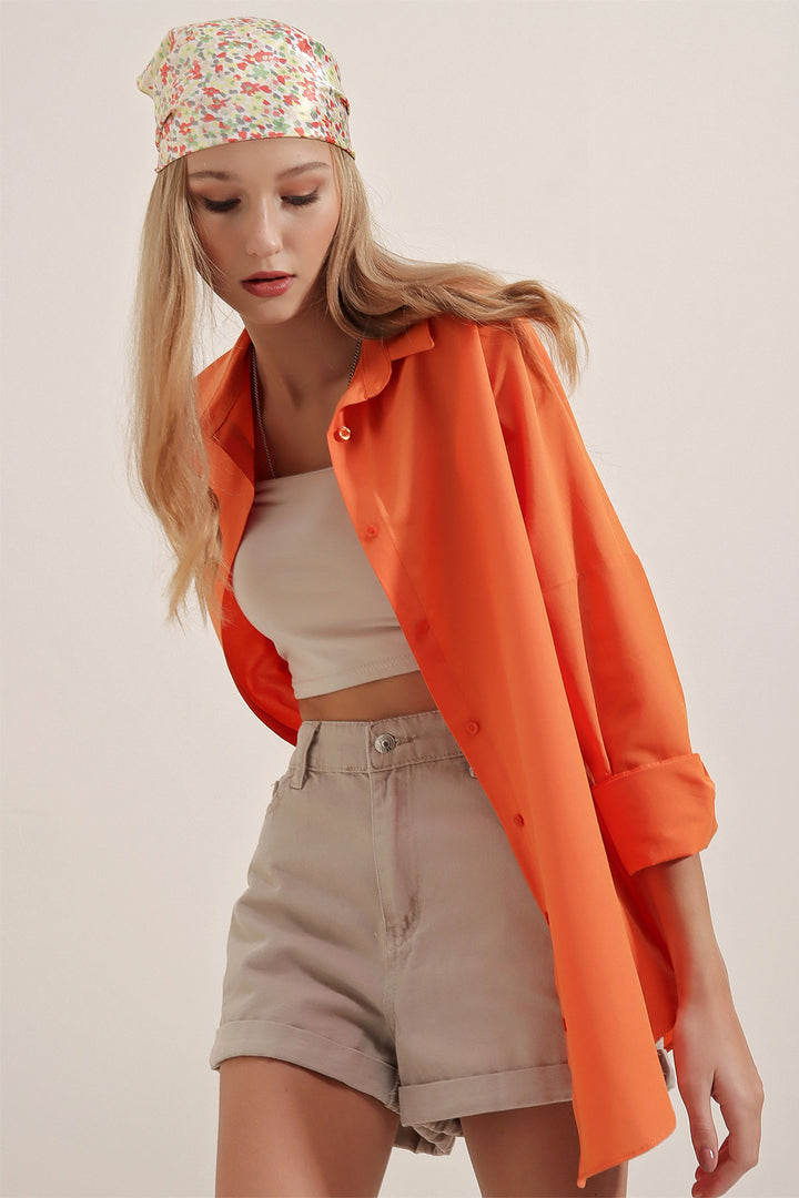 قميص برتقالي نسائي