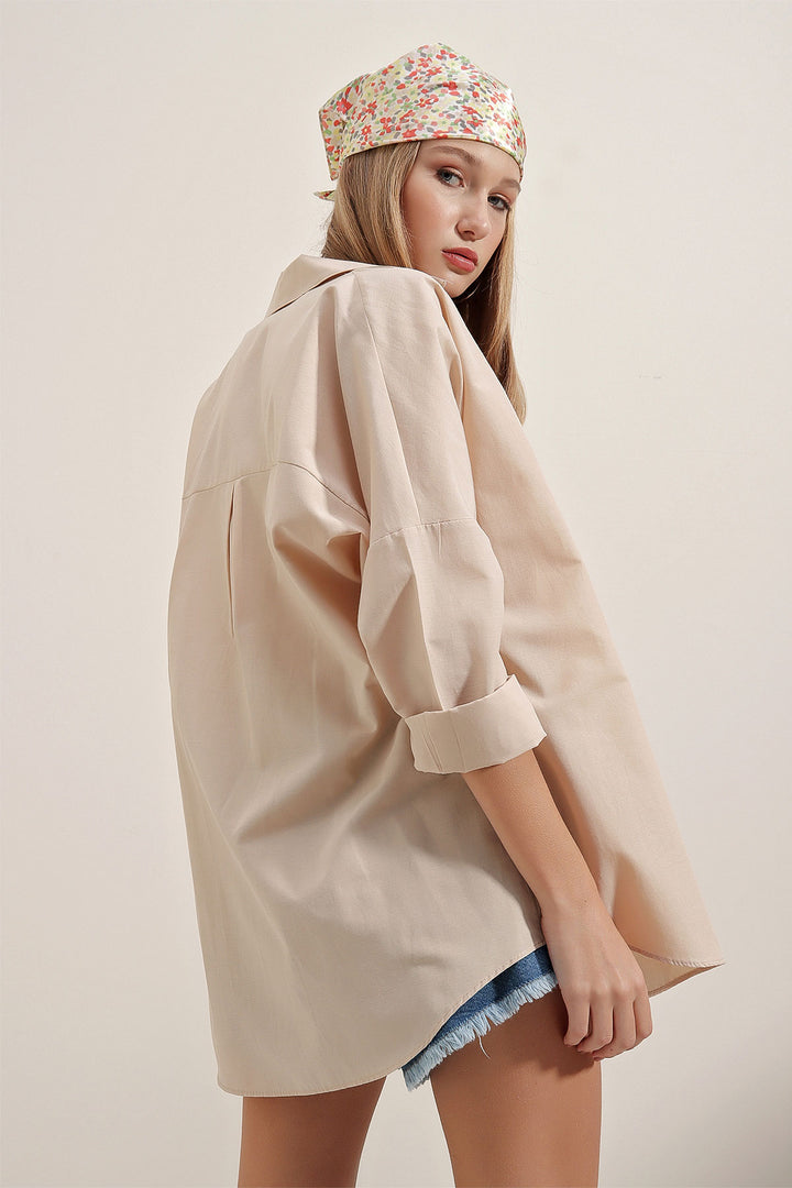 قميص كريمي نسائي