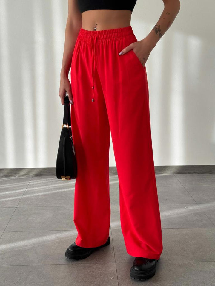 بنطلون واسع الساق مع خصر مطاطي باللون الأحمر