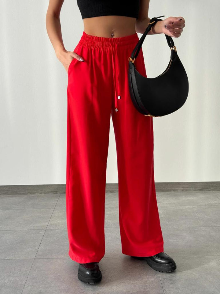 بنطلون واسع الساق مع خصر مطاطي باللون الأحمر